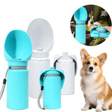 Folding pet water bottle in use during outdoor walk - Blue